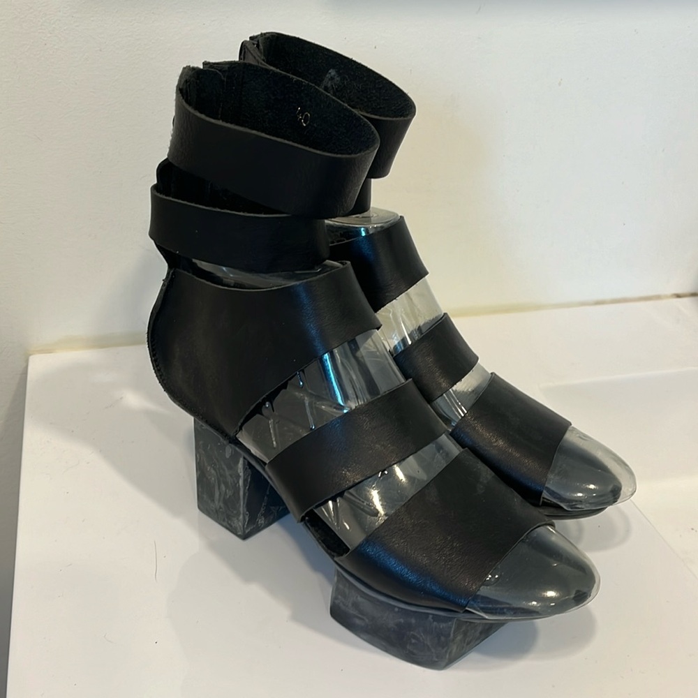 Unique and edgy Trippen black leather sandals